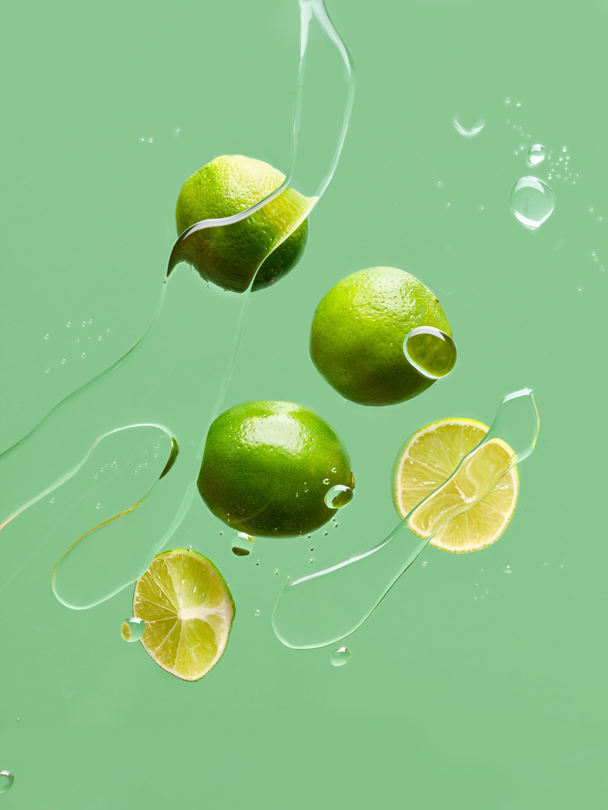 Floating Food Limes on Green Background